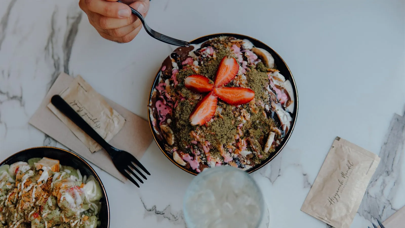 A delightful dessert bowl topped with fresh strawberries, perfect for a sweet treat.